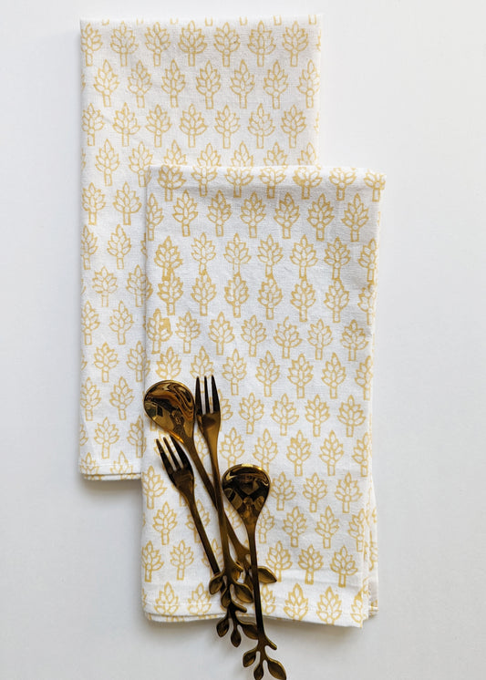 Reversible cotton table napkins adorned with a charming block-printed floral pattern on one side and a complementary design on the other, offering versatility and style to your dining setting.